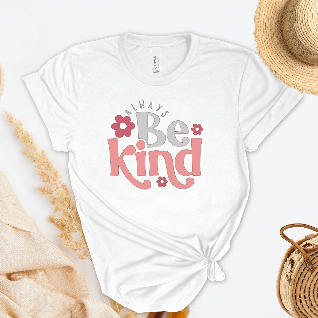 White t-shirt with 'Always Be Kind' text on a light background