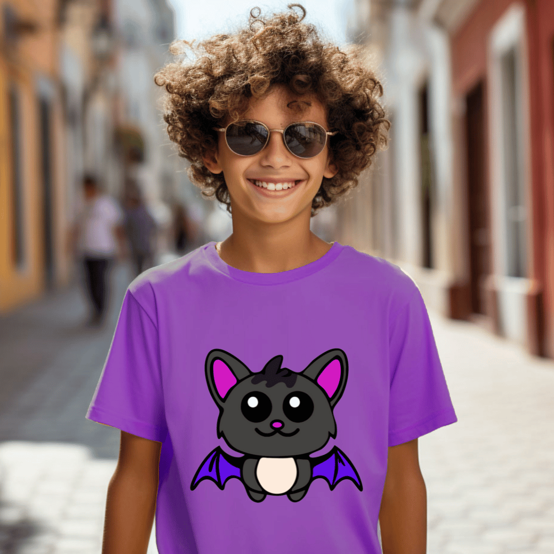 Child wearing a purple t-shirt with a bat design on a street background