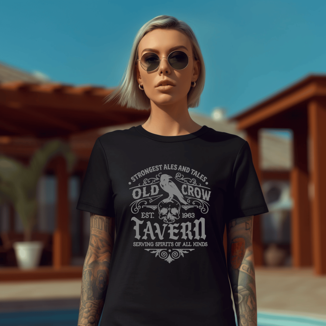 Person wearing a black t-shirt with 'Old Crow Tavern' design outdoors.