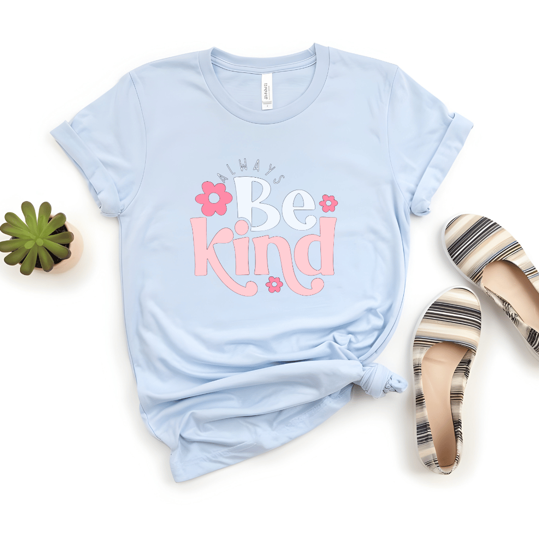 Light blue t-shirt with 'Be Kind' text on a white background