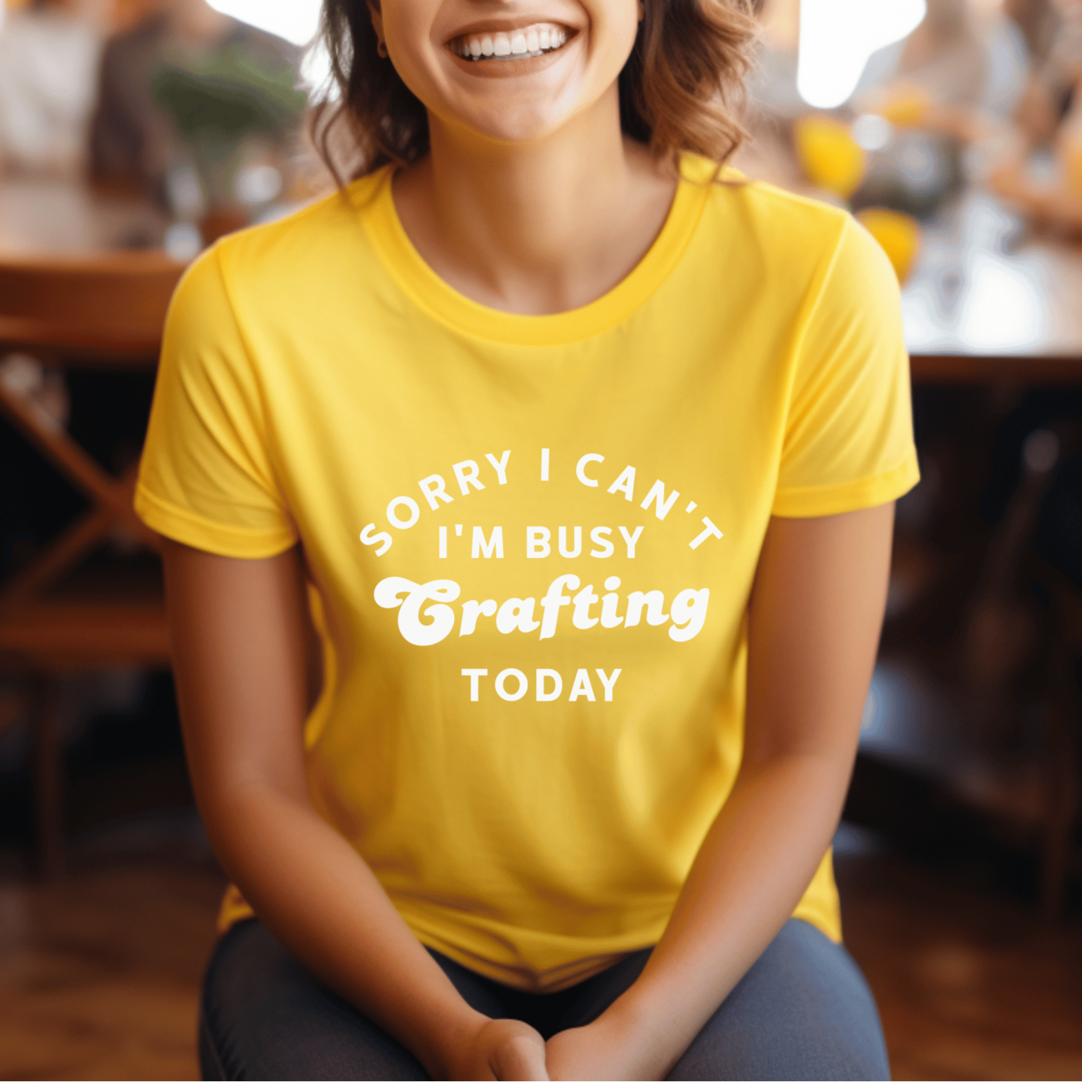 Woman wearing a yellow t-shirt with text in a casual setting