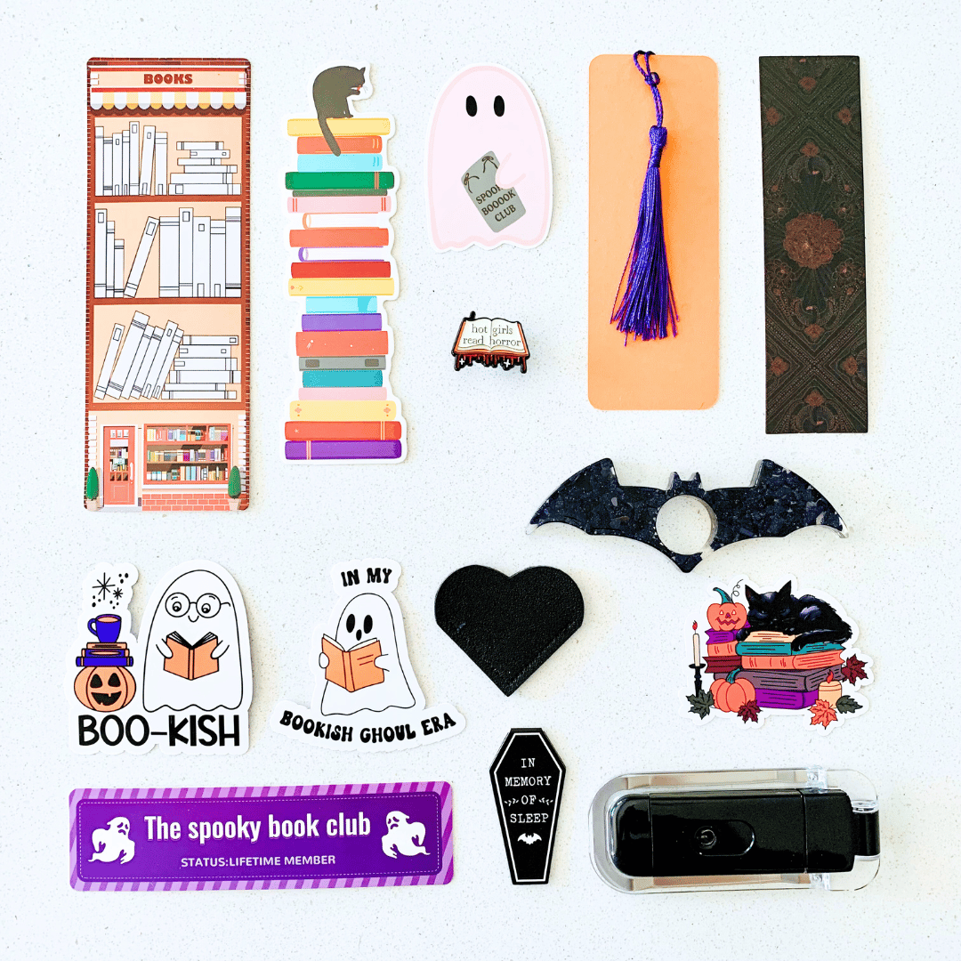 Collection of Halloween-themed bookmarks, stickers, and a card on a white background
