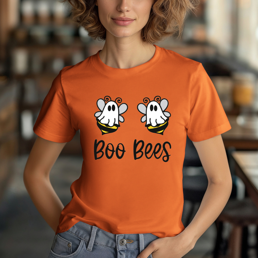 Person wearing an orange t-shirt with 'Boo Bees' design in a casual setting