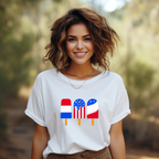 Woman wearing a white t-shirt with colorful popsicle design outdoors