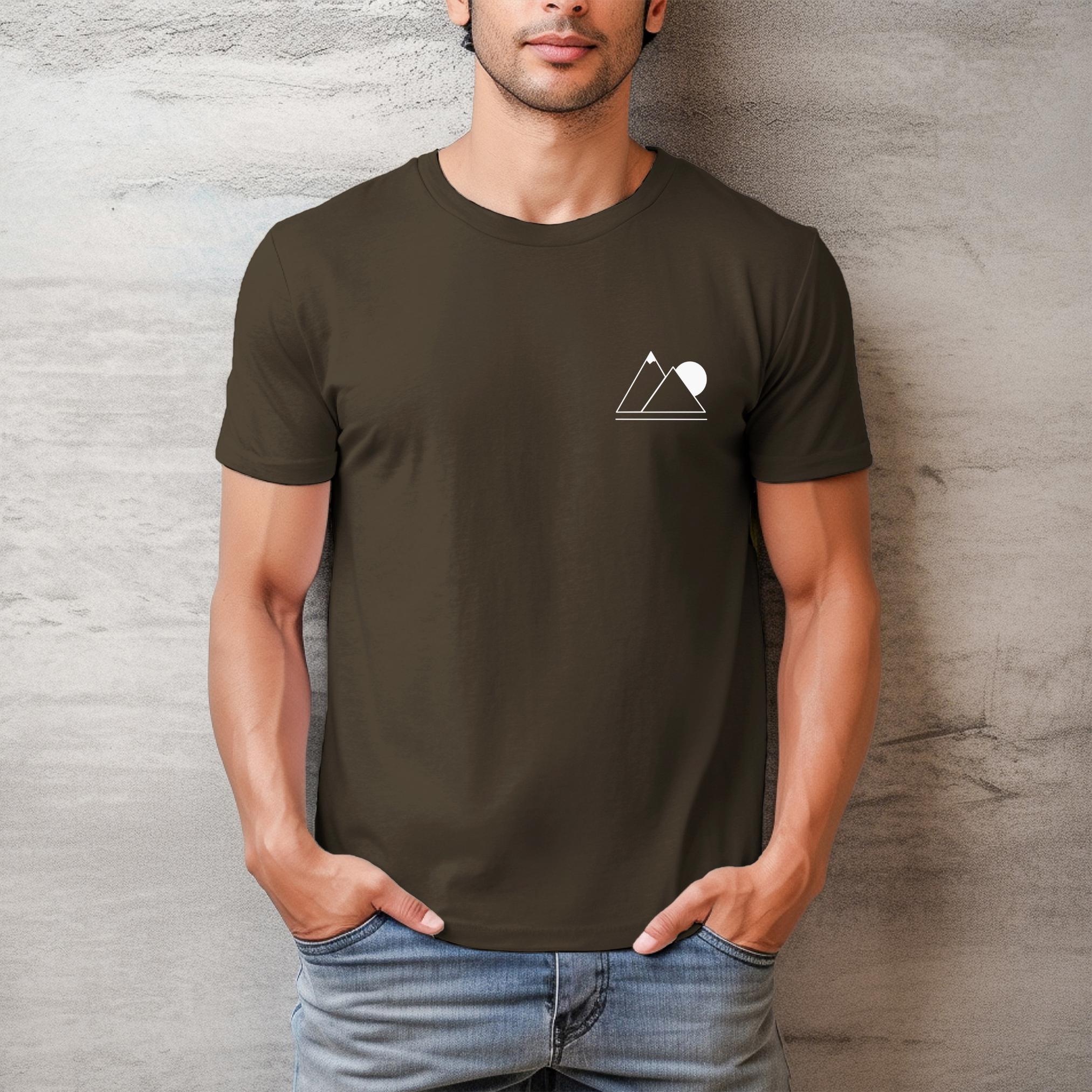 A person wearing a green t-shirt with a simple geometric mountain silhouette on the front.