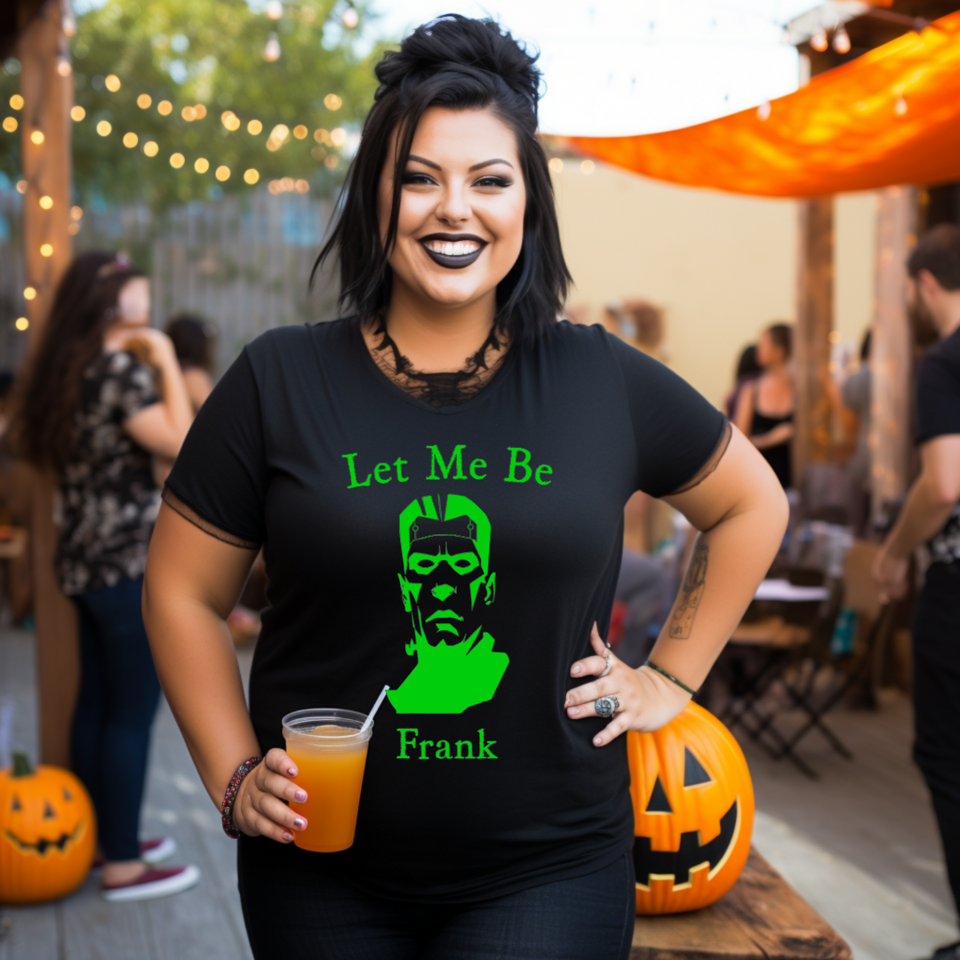 Woman wearing a Halloween-themed shirt with a green monster graphic and text, standing in a festive outdoor setting.