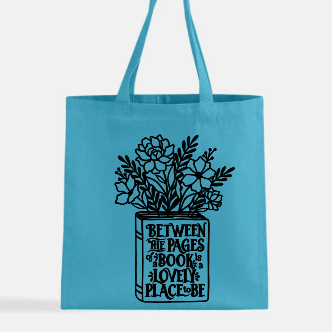 Teal tote bag with floral design and text on a white background