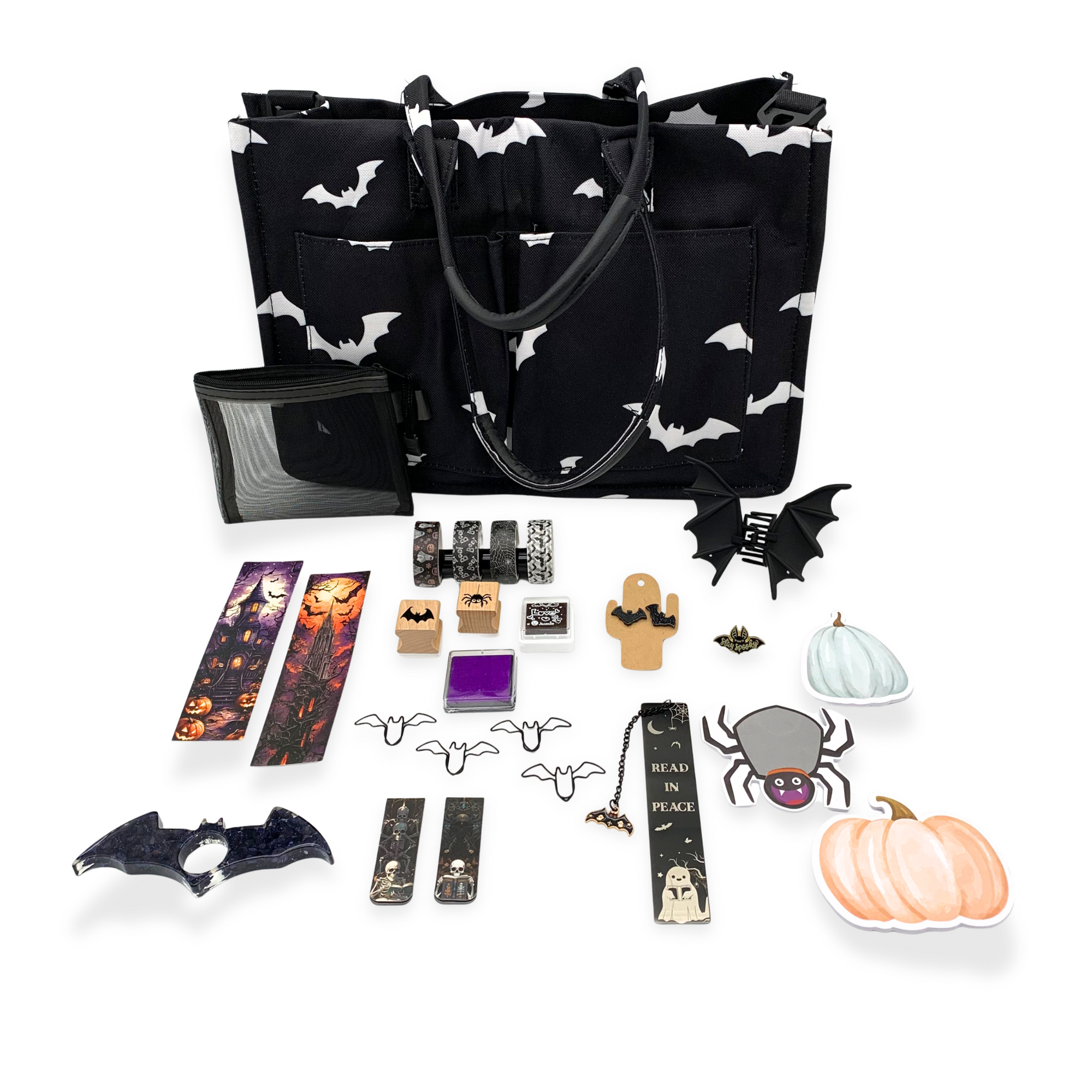 Black tote bag with white bat pattern, various Halloween-themed accessories on a white background