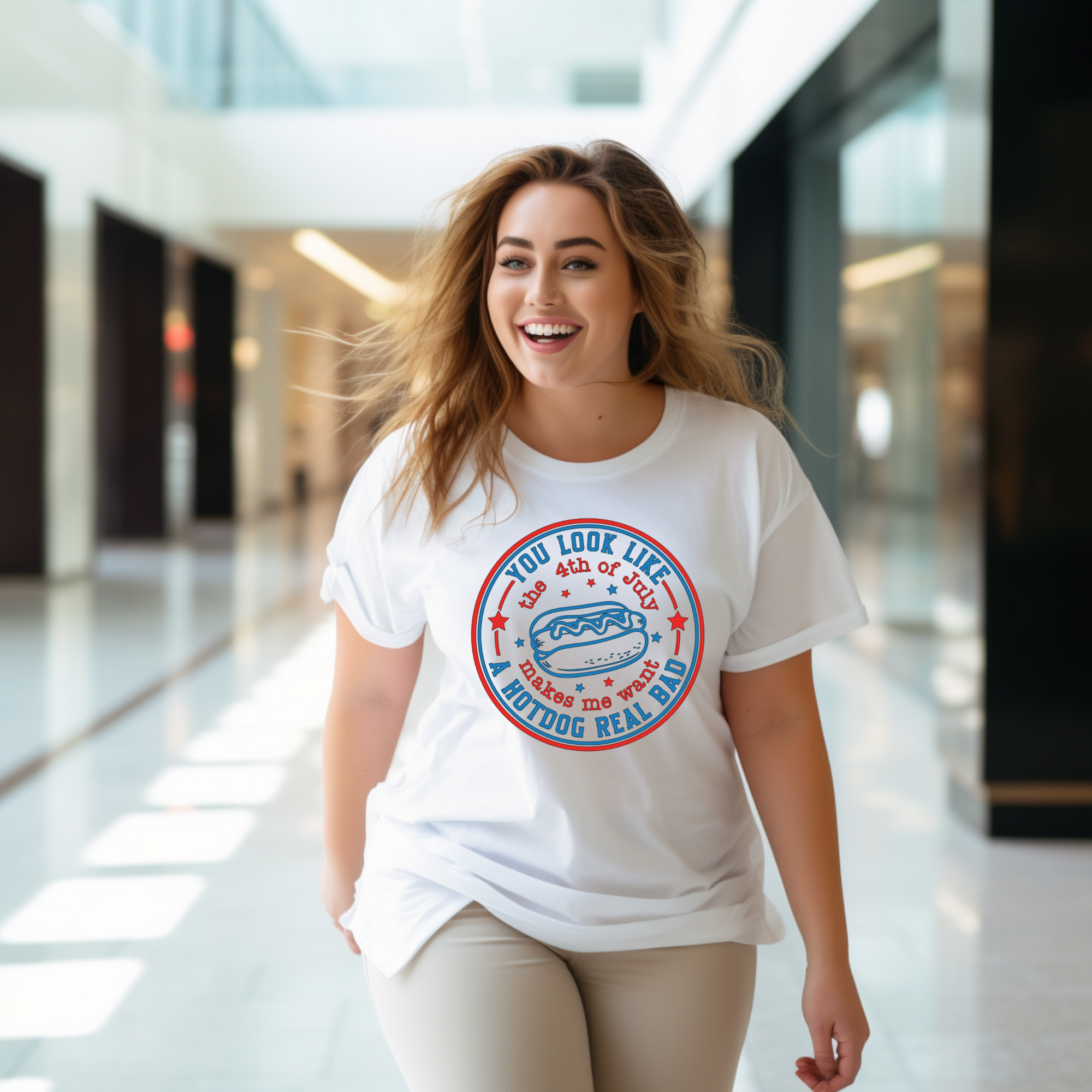 Woman wearing a white t-shirt with a graphic design in a modern indoor setting