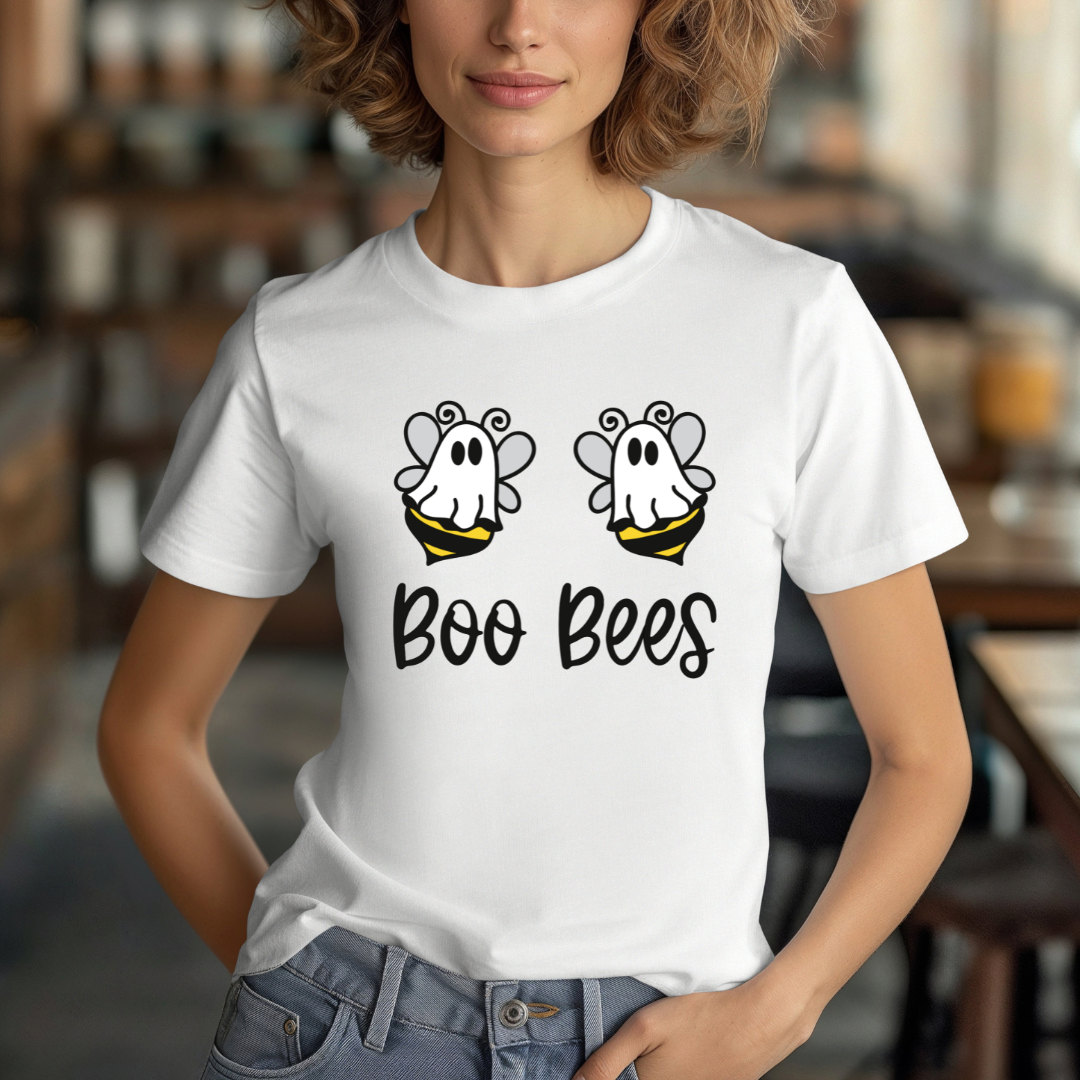 Person wearing a white t-shirt with 'Boo Bees' design in a casual setting
