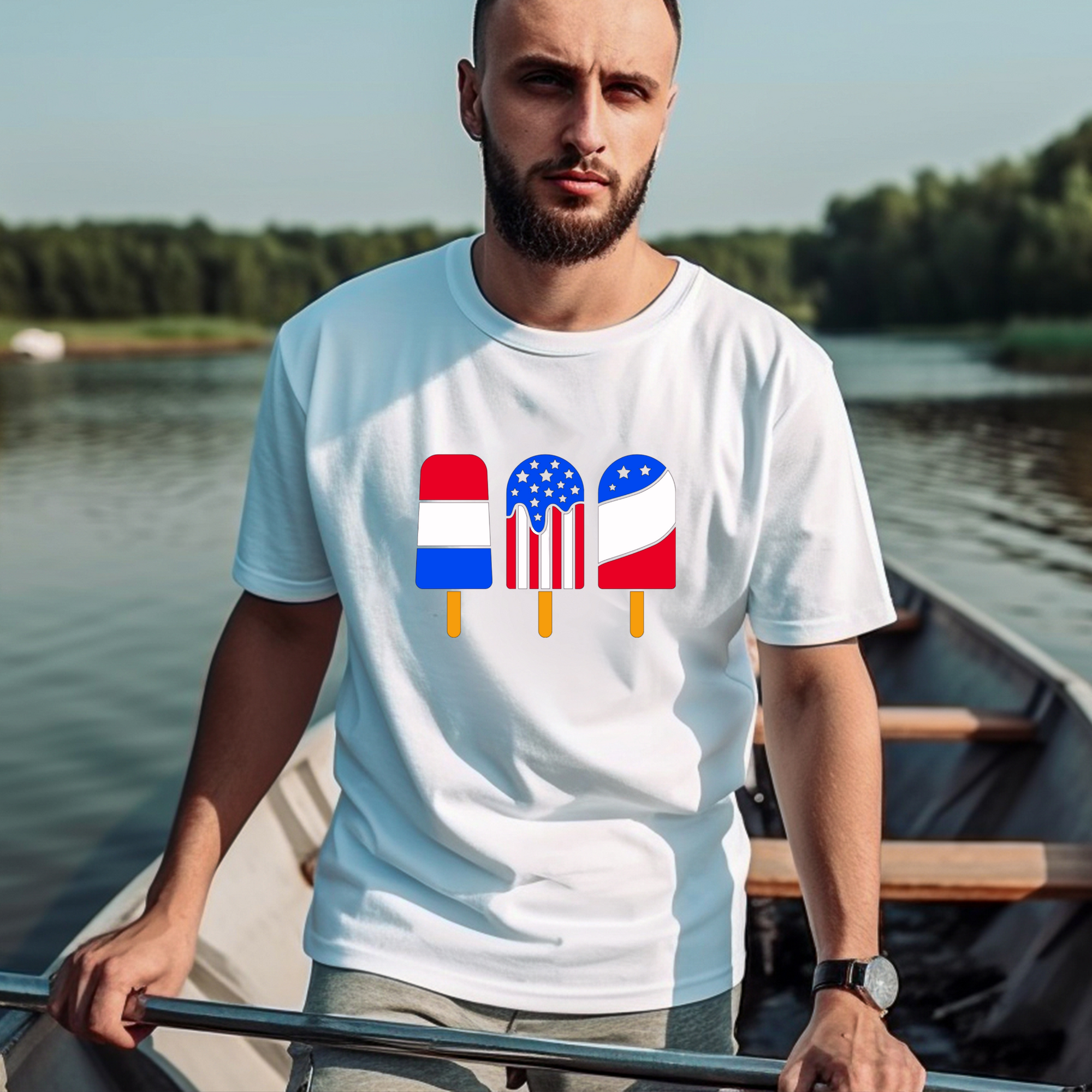 Man wearing a white t-shirt with colorful flag design by a lake