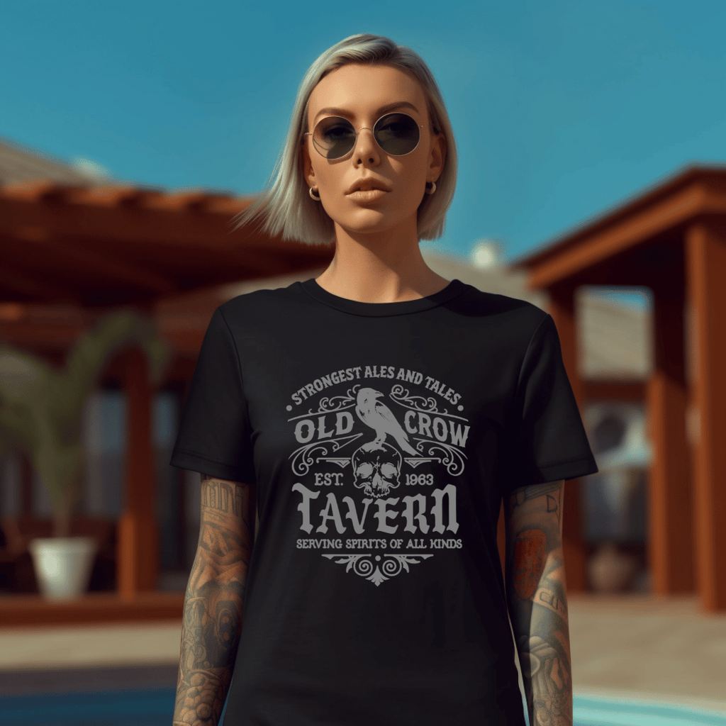 Person wearing a black t-shirt with 'Old Crow Tavern' design outdoors.