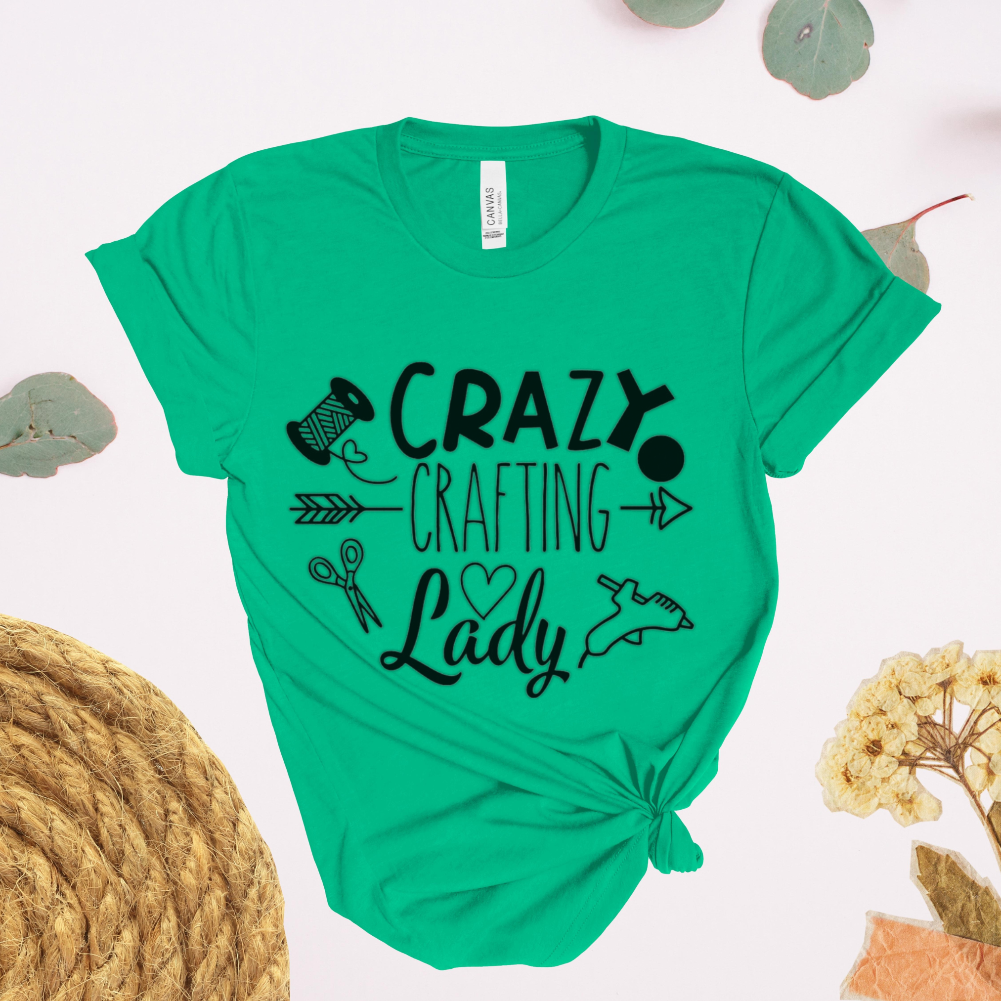 Green t-shirt with 'Crazy Crafting Lady' text and graphics on a white background