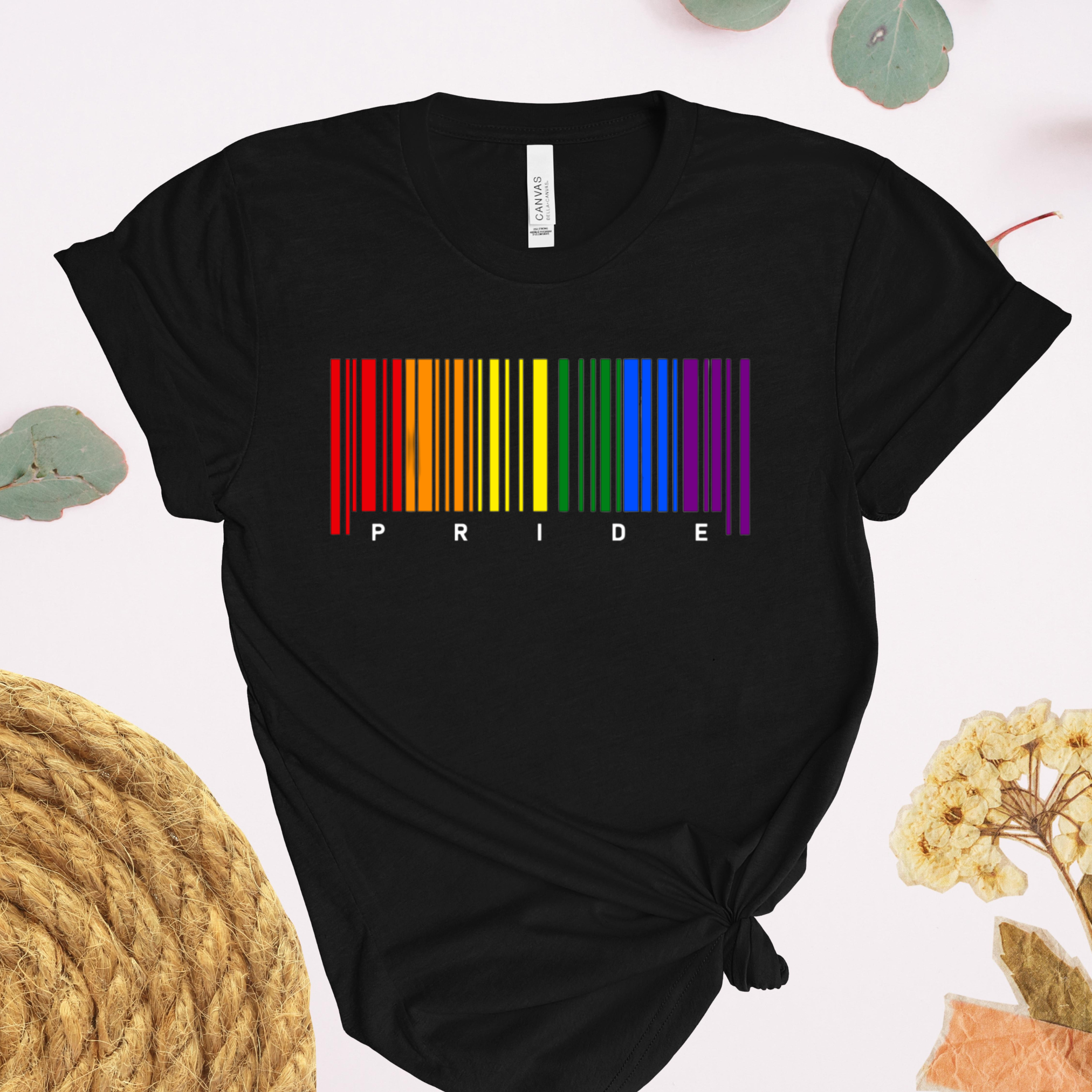 Black t-shirt with rainbow barcode and 'PRIDE' text on a light background