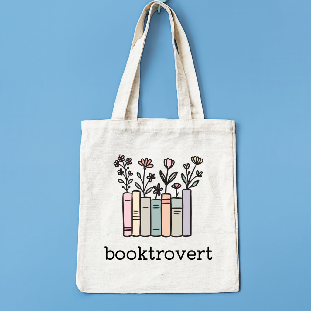 Tote bag with 'booktrovert' design on a blue background