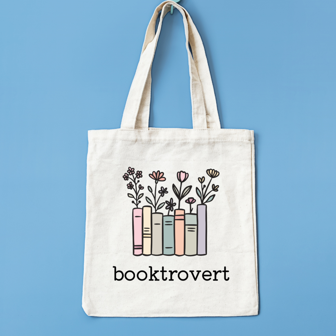 Tote bag with 'booktrovert' design on a blue background