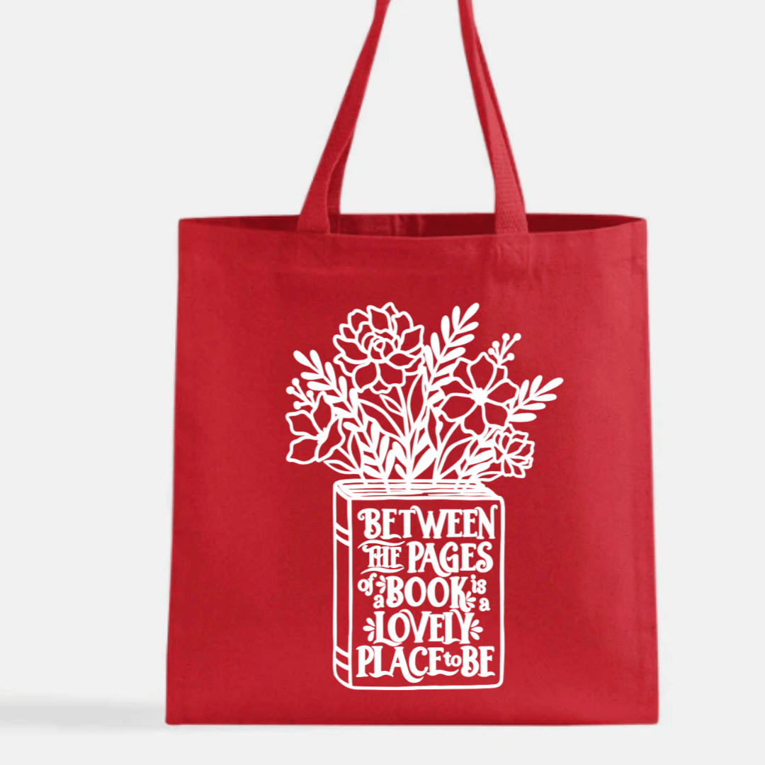 Red tote bag with white floral design and text on a white background