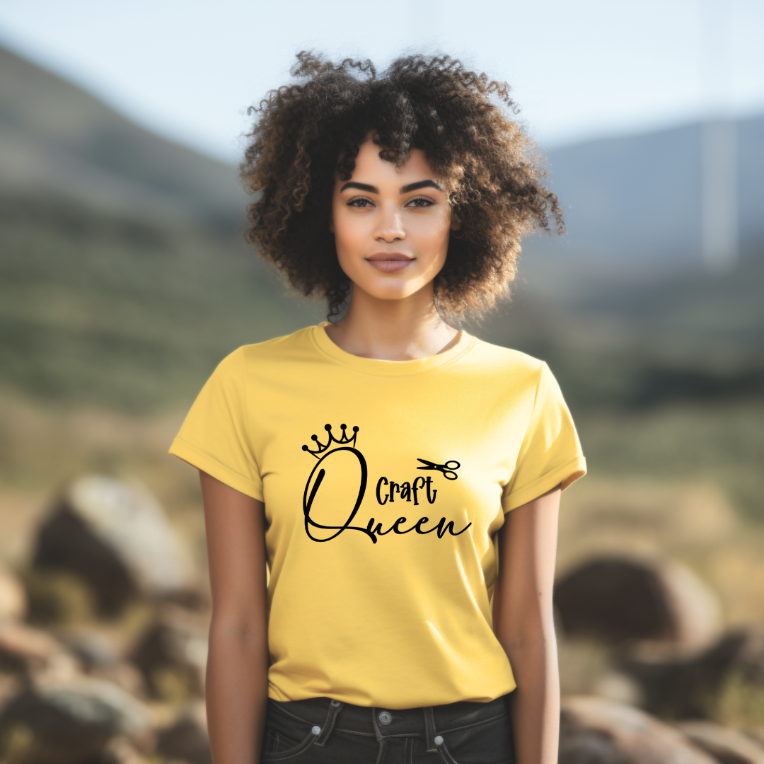 Woman wearing a yellow t-shirt with 'Craft Queen' text in a natural setting