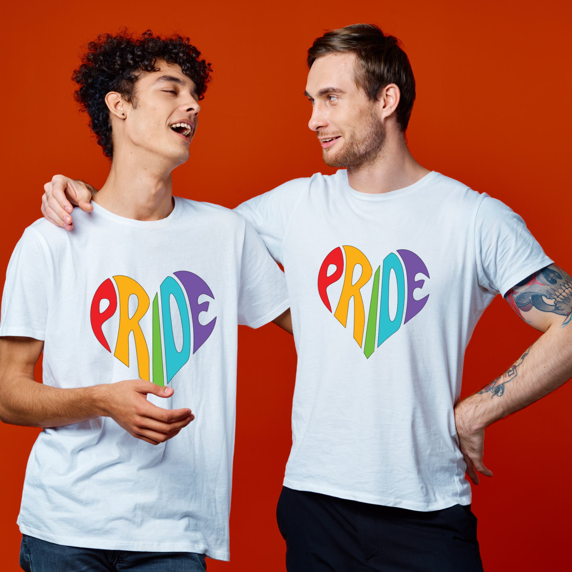 Two people wearing white t-shirts with 'PRIDE' in colorful letters on a red background