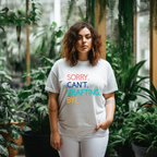 A woman in a white t-shirt with the text 'Sorry. Can't. Crafting. Bye.', each line with a different color text.