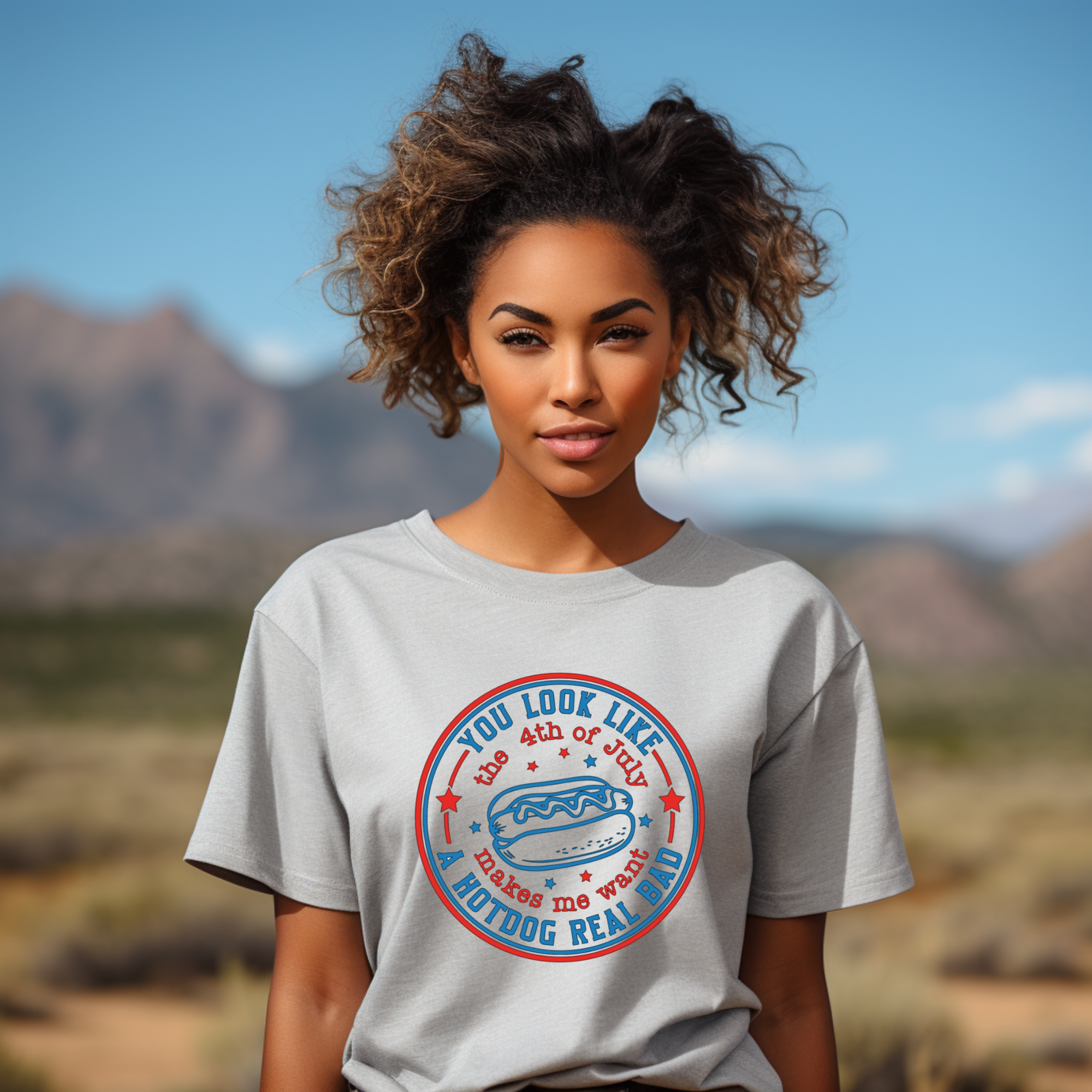 Woman wearing a t-shirt with a graphic design in a desert setting