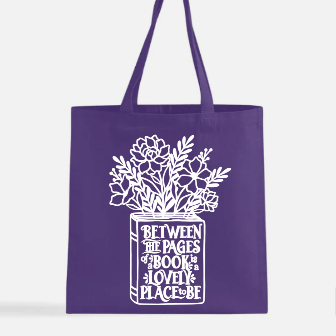 Purple tote bag with white floral design and text on a white background