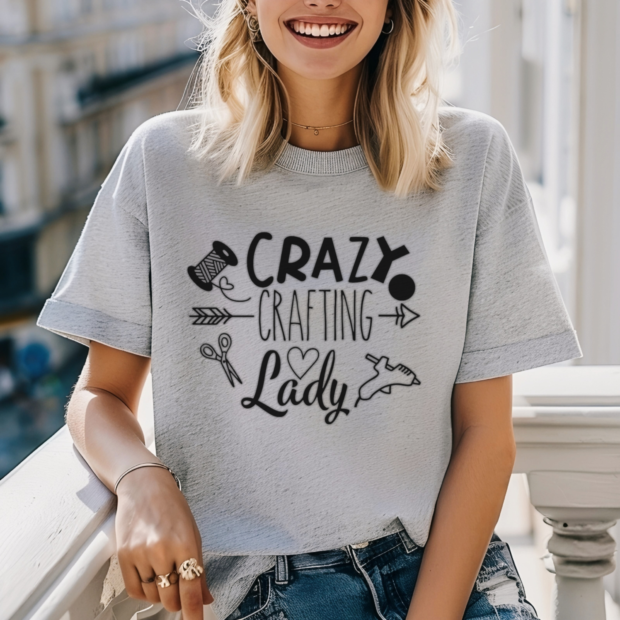 Person wearing a gray t-shirt with 'Crazy Crafting Lady' text and graphics.