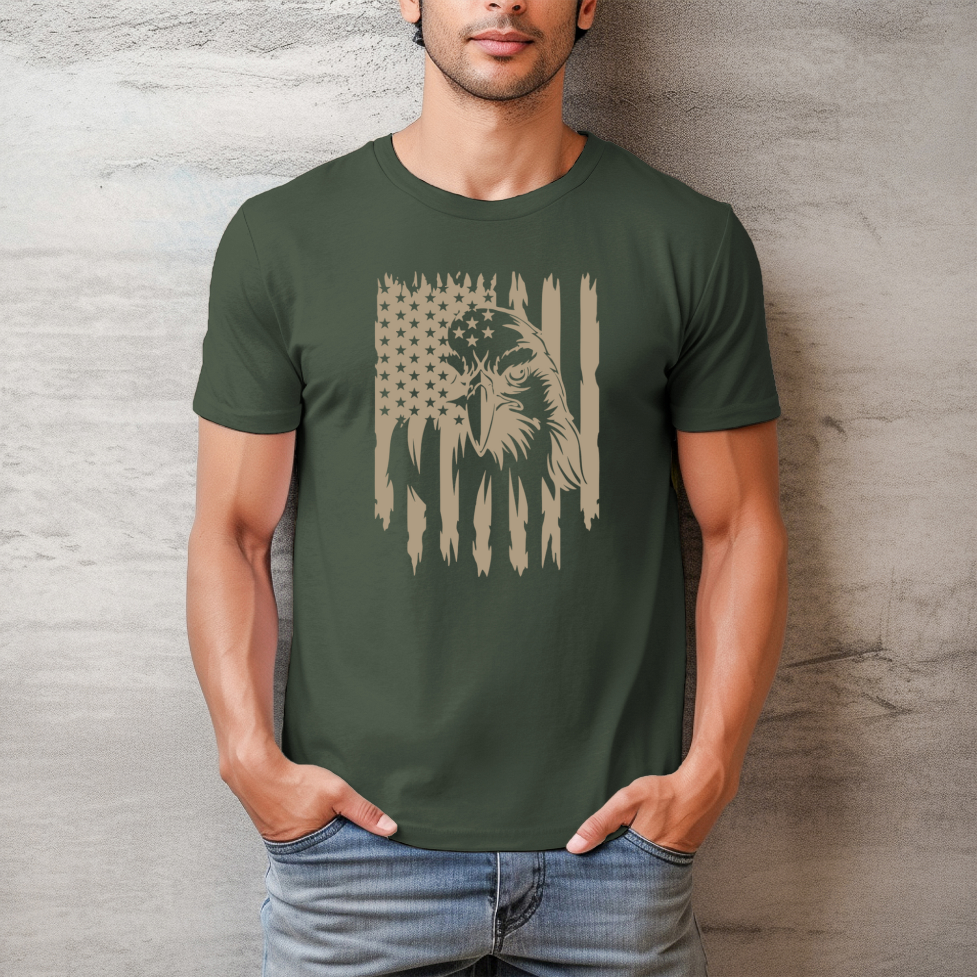 Man wearing a green t-shirt with an eagle and flag design against a textured wall.