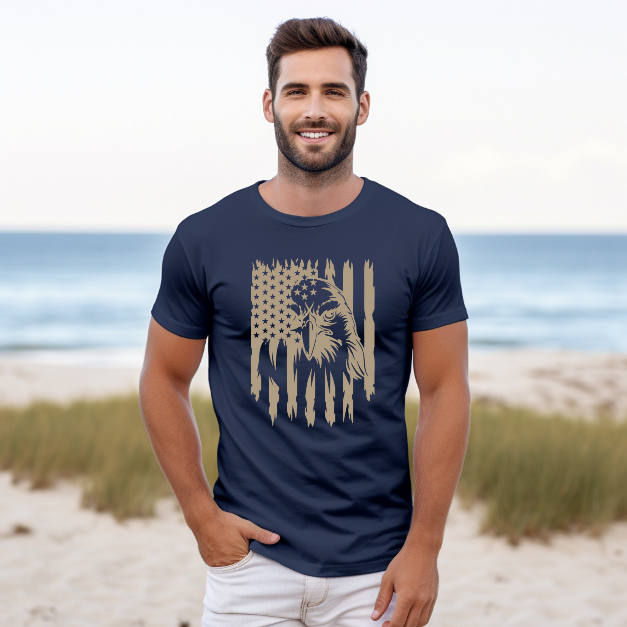 Man wearing a navy blue t-shirt with a graphic design on a beach