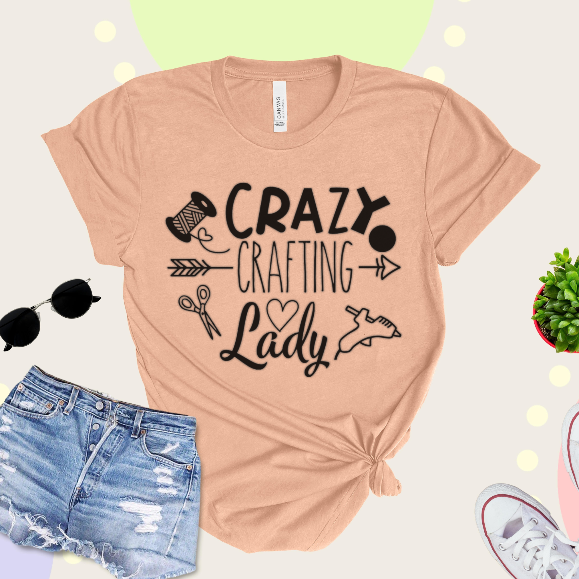 Peach t-shirt with 'Crazy Crafting Lady' text and graphics on a light background