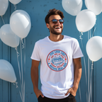 Man wearing a white t-shirt with a graphic design in front of white balloons against a blue wall.
