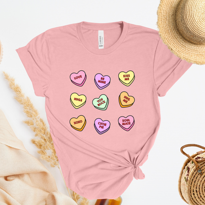 Shirt with conversation heart candies with phrases like "LOVE" and "BE MINE"