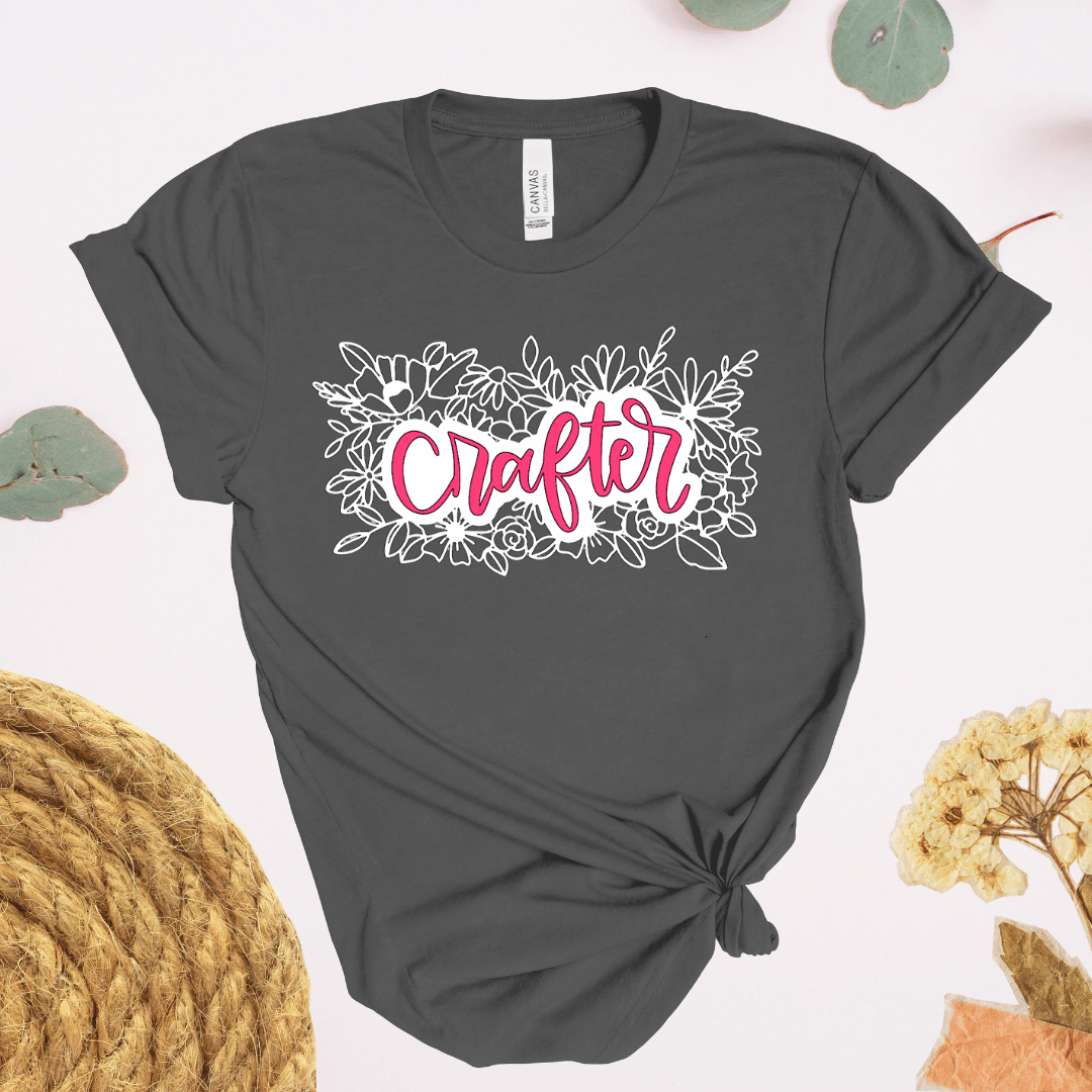 Crafter floral t-shirt in dark gray with pink hand-lettered script and black floral illustratio