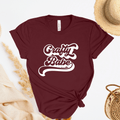 Maroon t-shirt with 'Crafty Babe' text on a light background