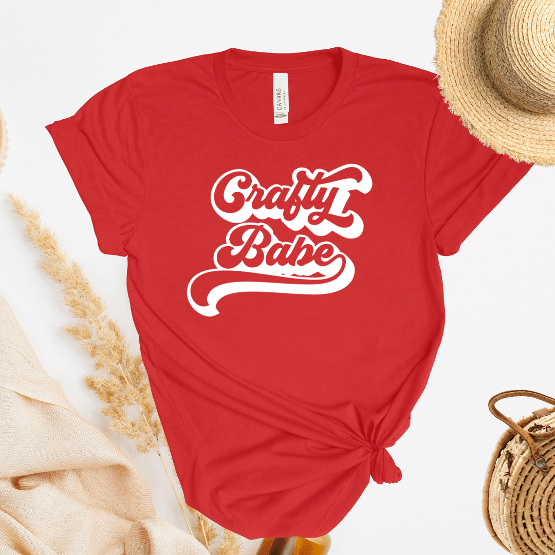 Red t-shirt with 'Crafty Babe' text on a light background