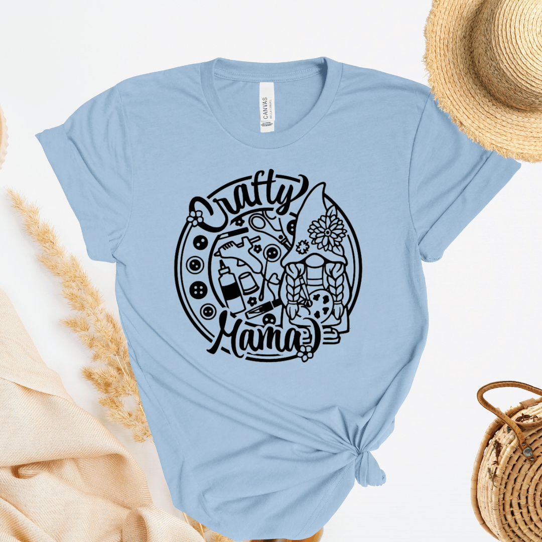 Light blue t-shirt with 'Crafty Mama' graphic design on a white background