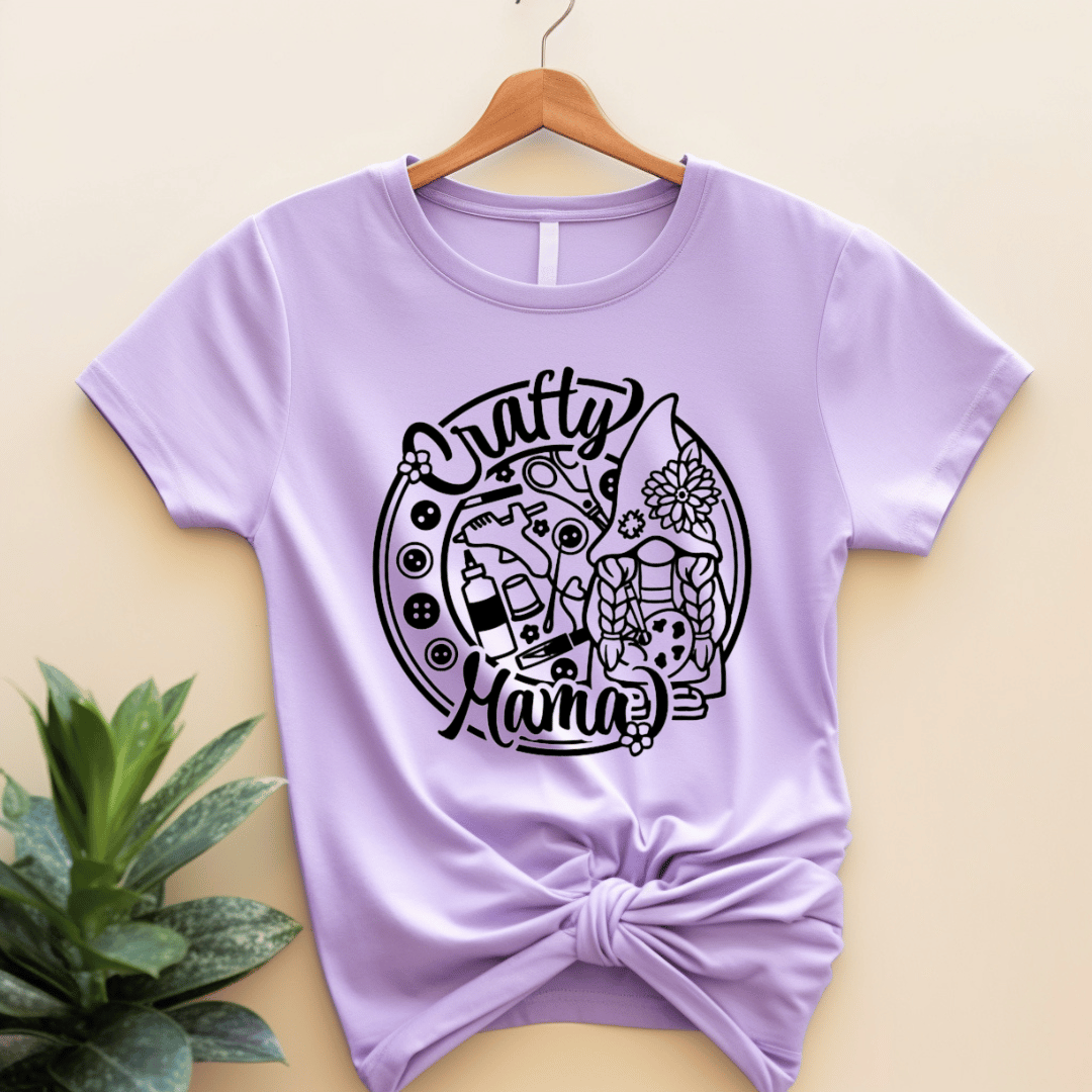 Light purple t-shirt with 'Crafty Mama' design with buttons and craft supplies.