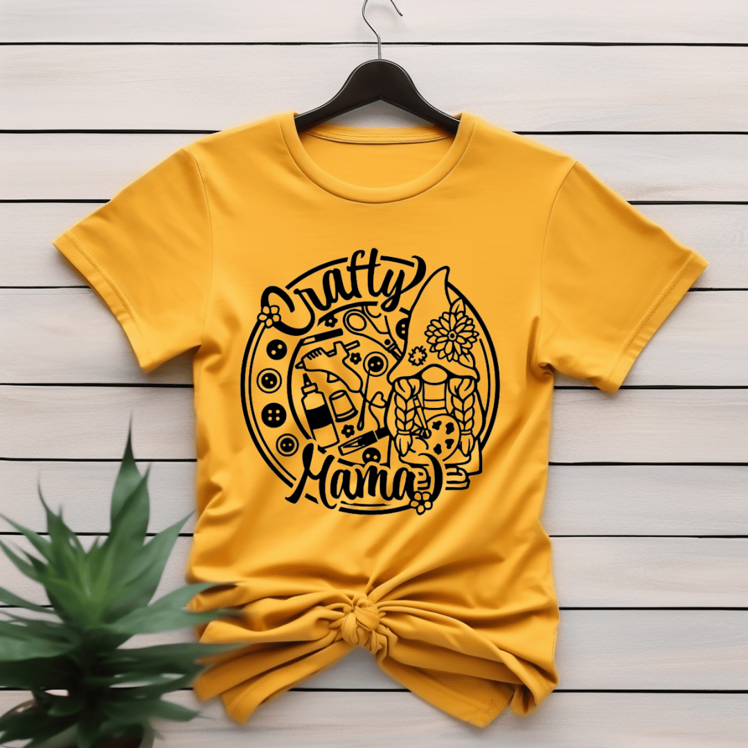 Yellow t-shirt with 'Crafty Mama' design with buttons and craft supplies.