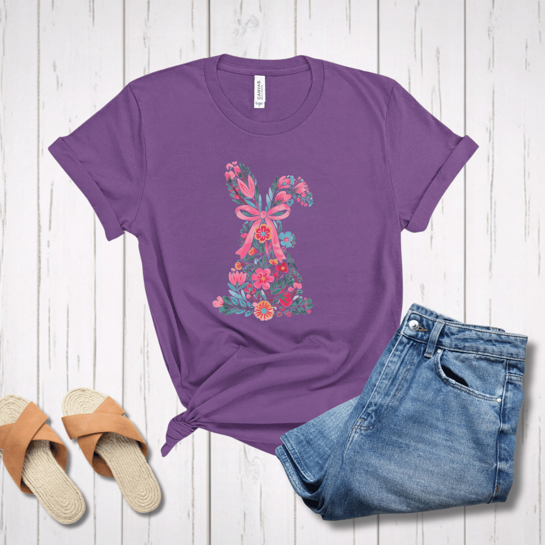 Floral Easter bunny t-shirt in purple styled with jeans & sandals on white wood