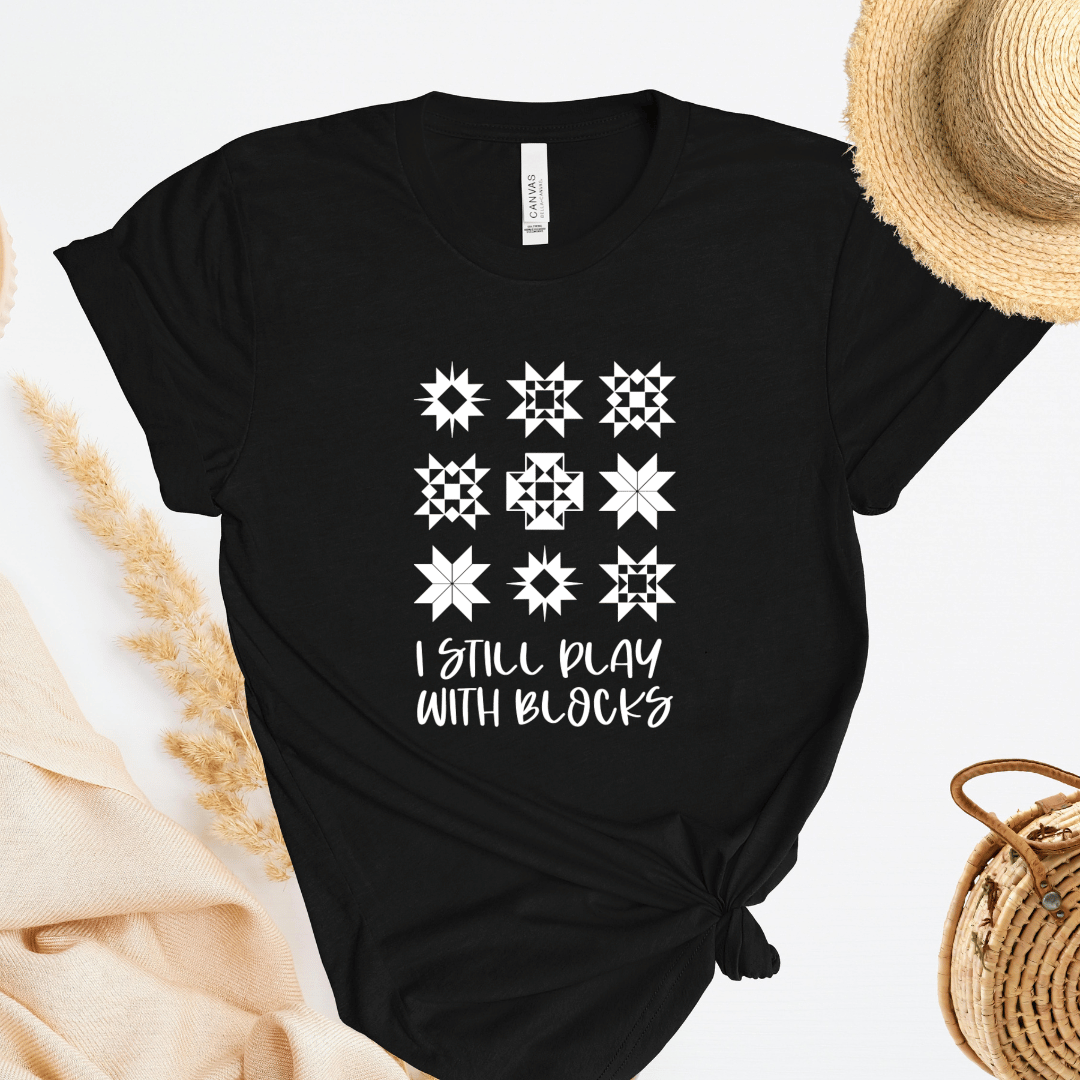 I Still Play With Blocks funny quilting t-shirt in black with quilt star block grid design