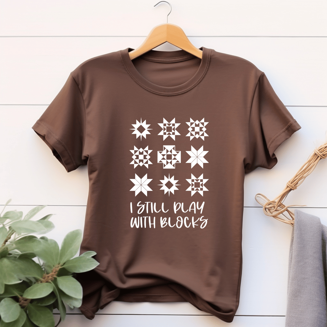 I Still Play With Blocks funny quilting t-shirt in brown with quilt star block grid design