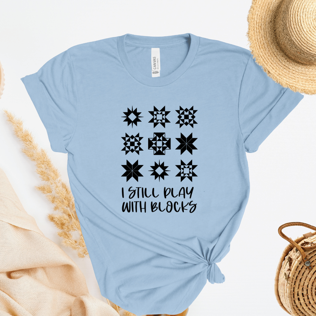 I Still Play With Blocks funny quilting t-shirt in light blue with quilt star block grid design