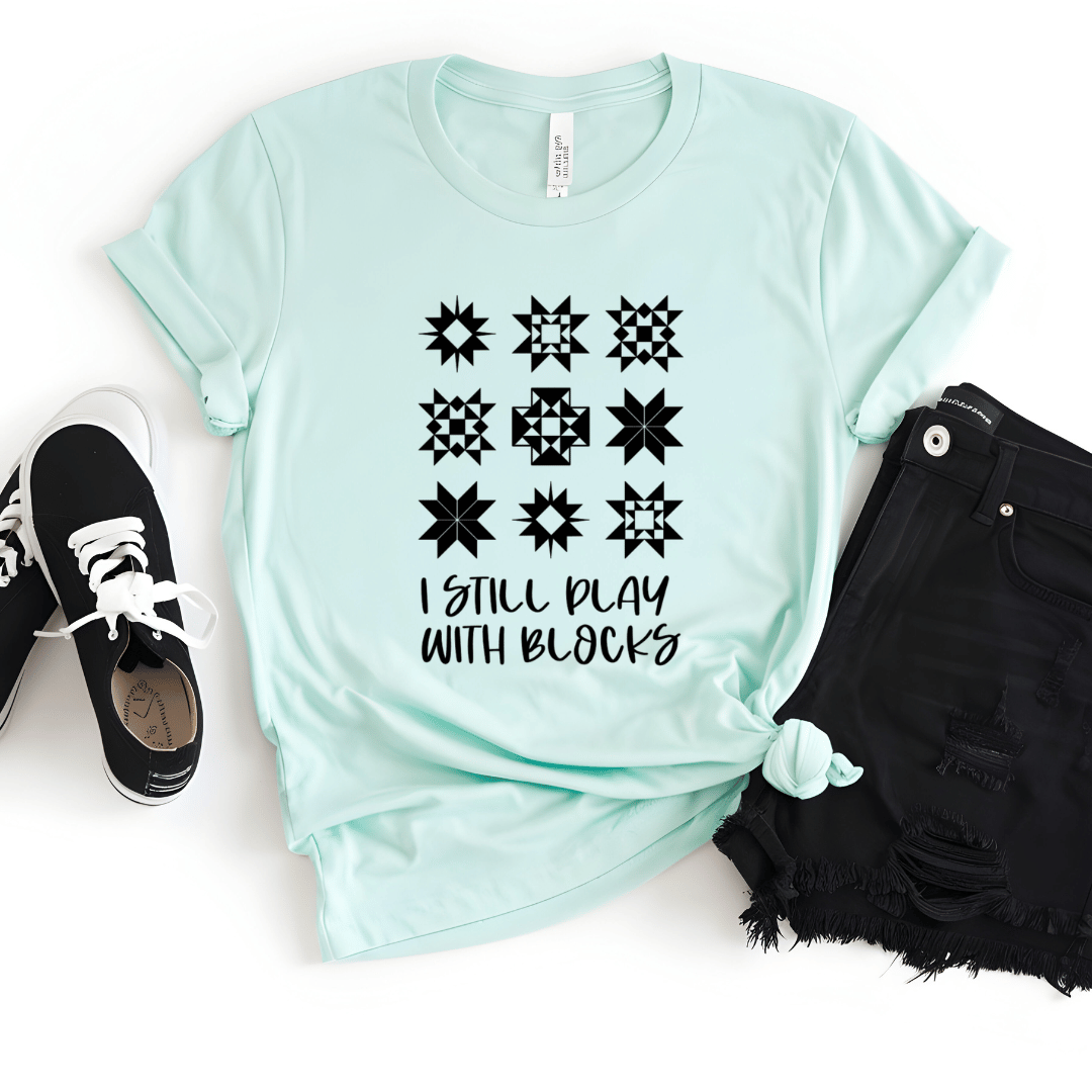 I Still Play With Blocks funny quilting t-shirt in mint green with quilt star block grid design