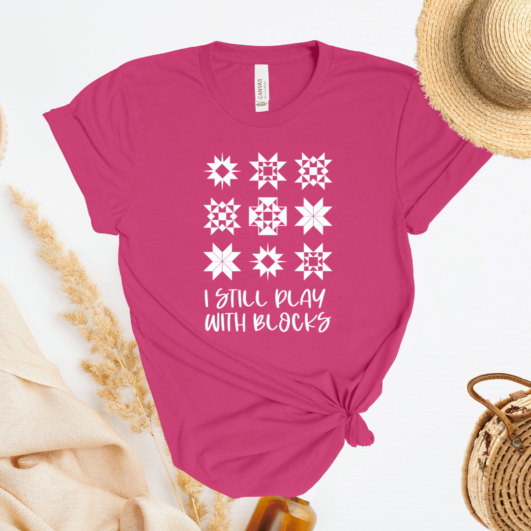I Still Play With Blocks funny quilting t-shirt in berry pink with quilt star block grid design