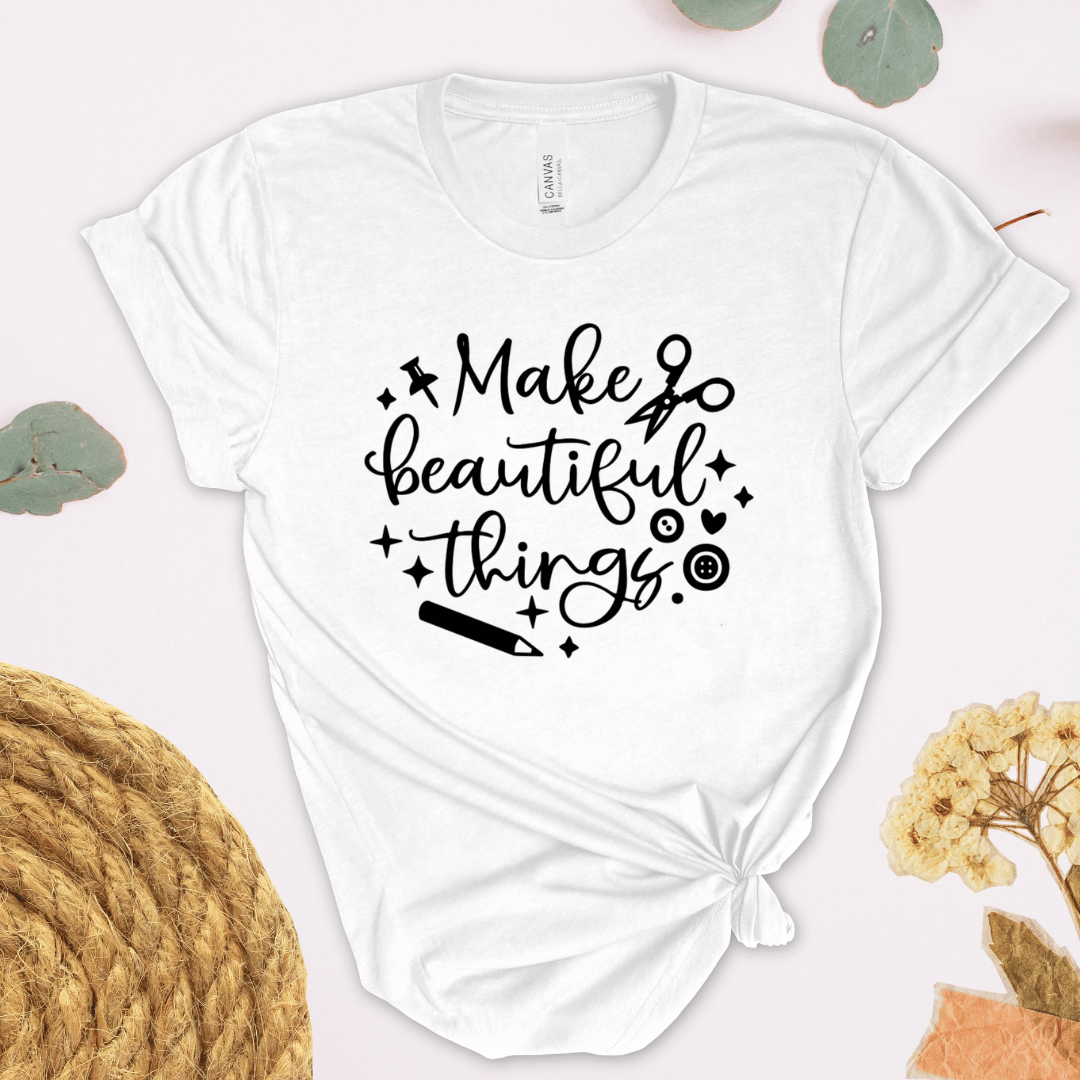 White crafting themed t-shirt with 'Make beautiful things' text on a light background