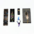 Four celestial bookmarks, a galaxy thumb page holder and a gold metal feather bookmark from the mystical witchy gift box