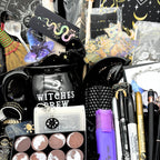 Close view of the mystical witchy gift box contents including the cauldron mug, moon trinket tray, moon phase stamps and washi tape