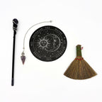Crystal wand with a purple skull and silver snake, amethyst pendulum, sun and moon pendulum board and a mini straw broom