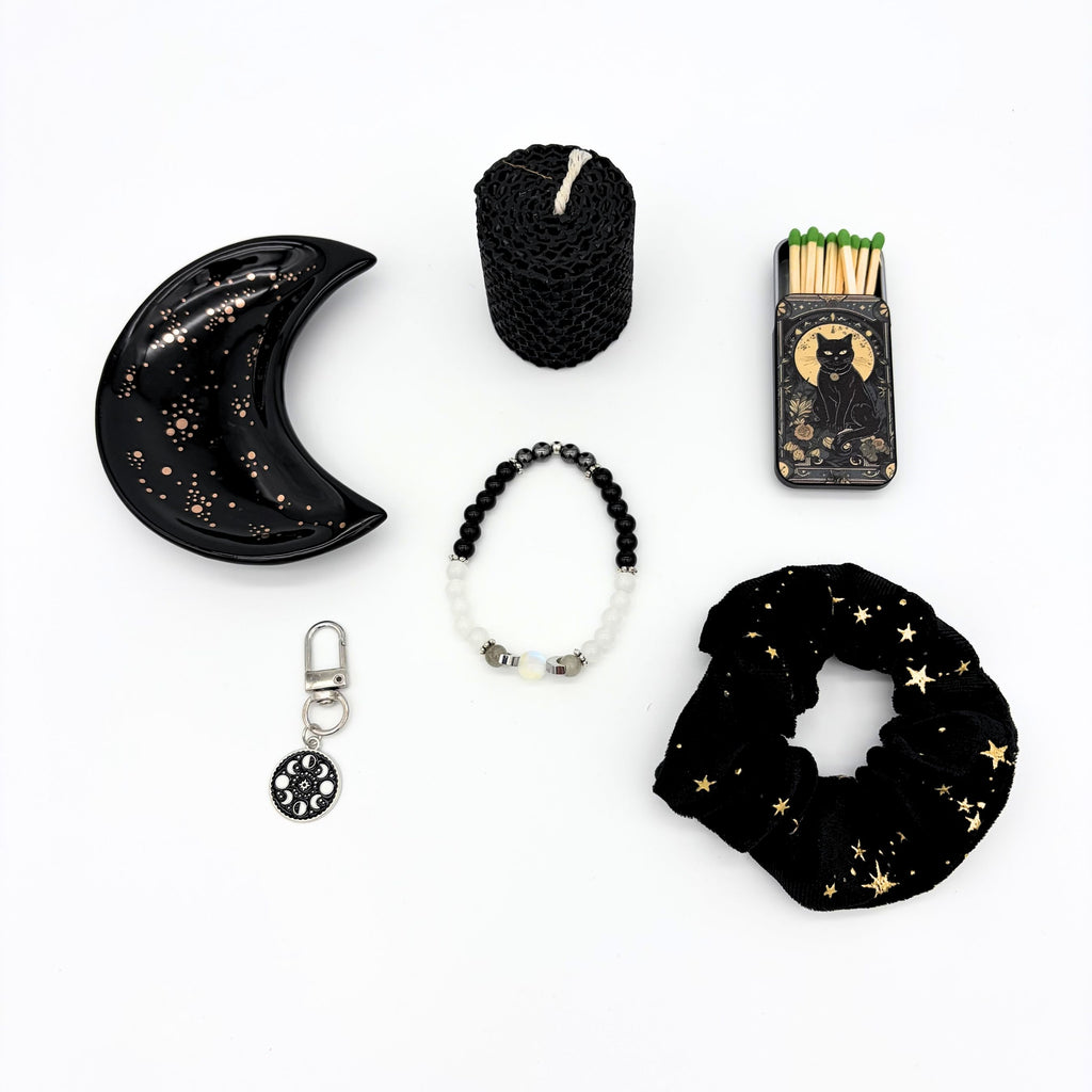 Crescent moon trinket tray, black beeswax candle, cat matchbox, moon phase bracelet, zipper pull and star scrunchie