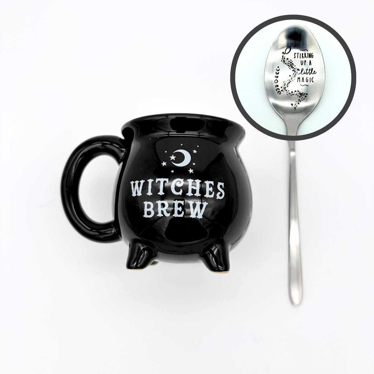 Witches brew cauldron mug in black with a crescent moon, shown with the silver spoon stamped stirring up a little magic